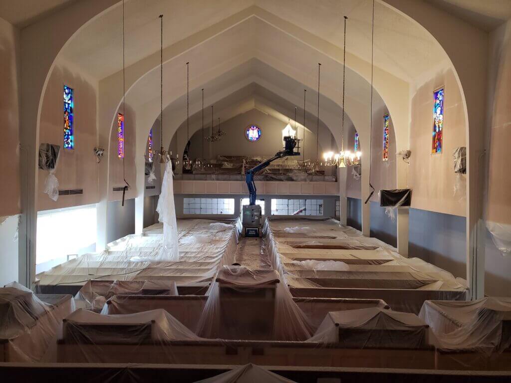 Church painters preparing sanctuary